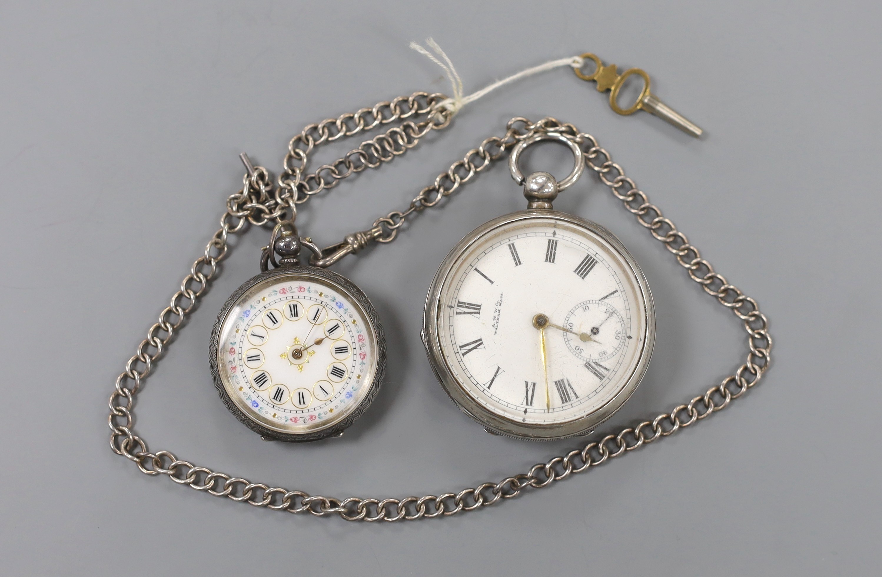 An Edwardian Waltham silver open face keywind pocket watch and a Swiss 935 white metal fob watch, on a white metal albert.